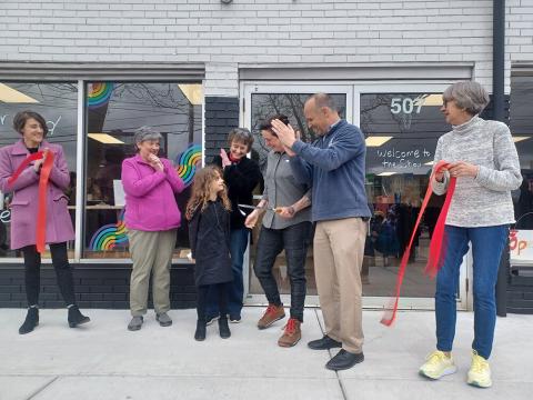 Tiny Bit of Wood owner Megan Shannon (center) cut the ribbon on her new studio space and storefront last Thursday (April 4). She was joined by (from left) Downtown Lansing Inc. Executive Director Cathleen Edgerly, mother Sandy Shannon, niece Mia Shannon, sixth-grade teacher Jan Warren, Lansing Mayor Andy Schor and fourth- and fifth-grade teacher Connie Crittenden.