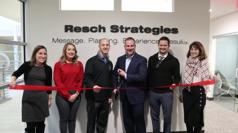 Group of people at Resch strategies ribbon cutting ceremony