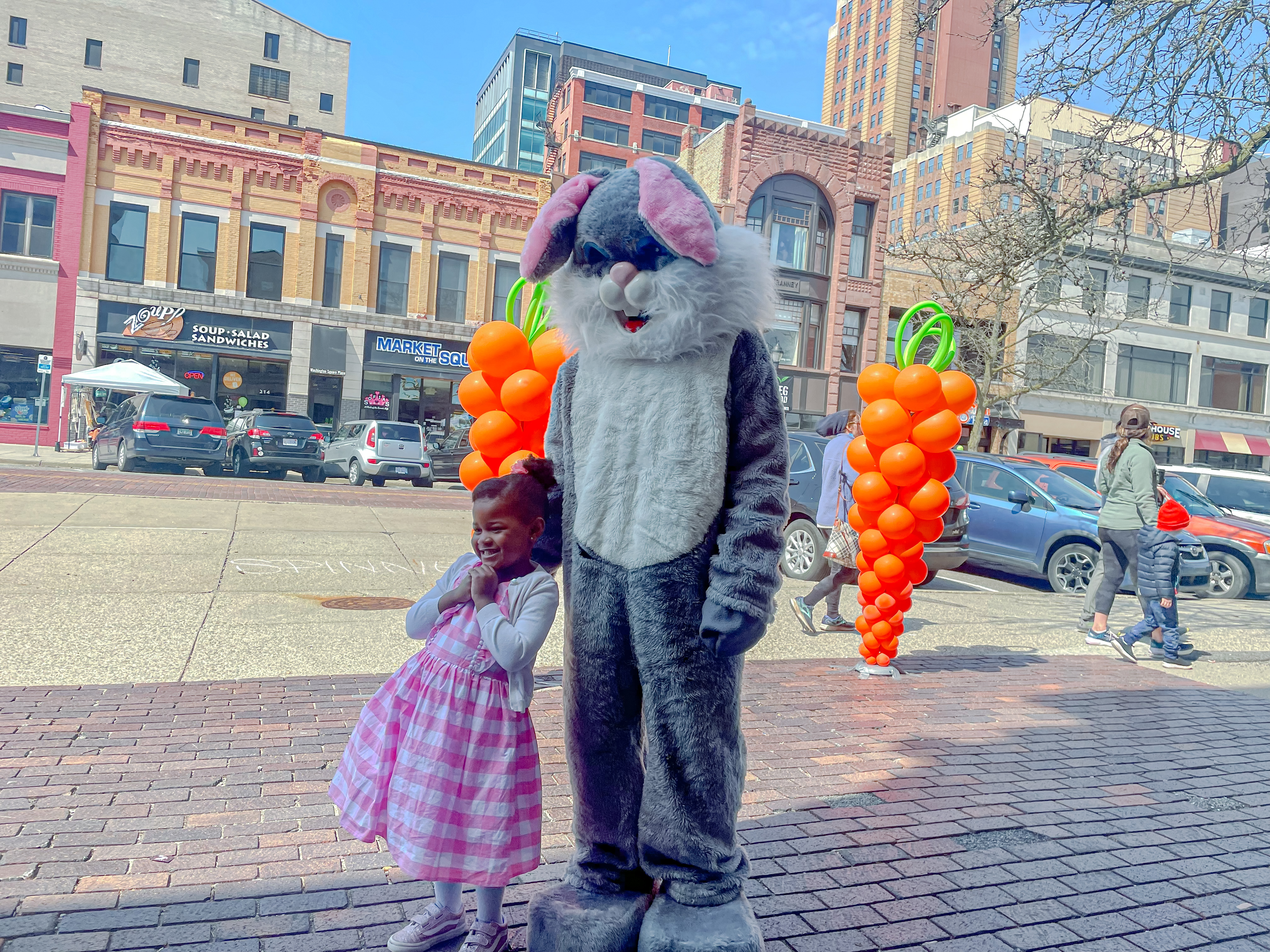 a child with the Easter Bunny on Washington Square
