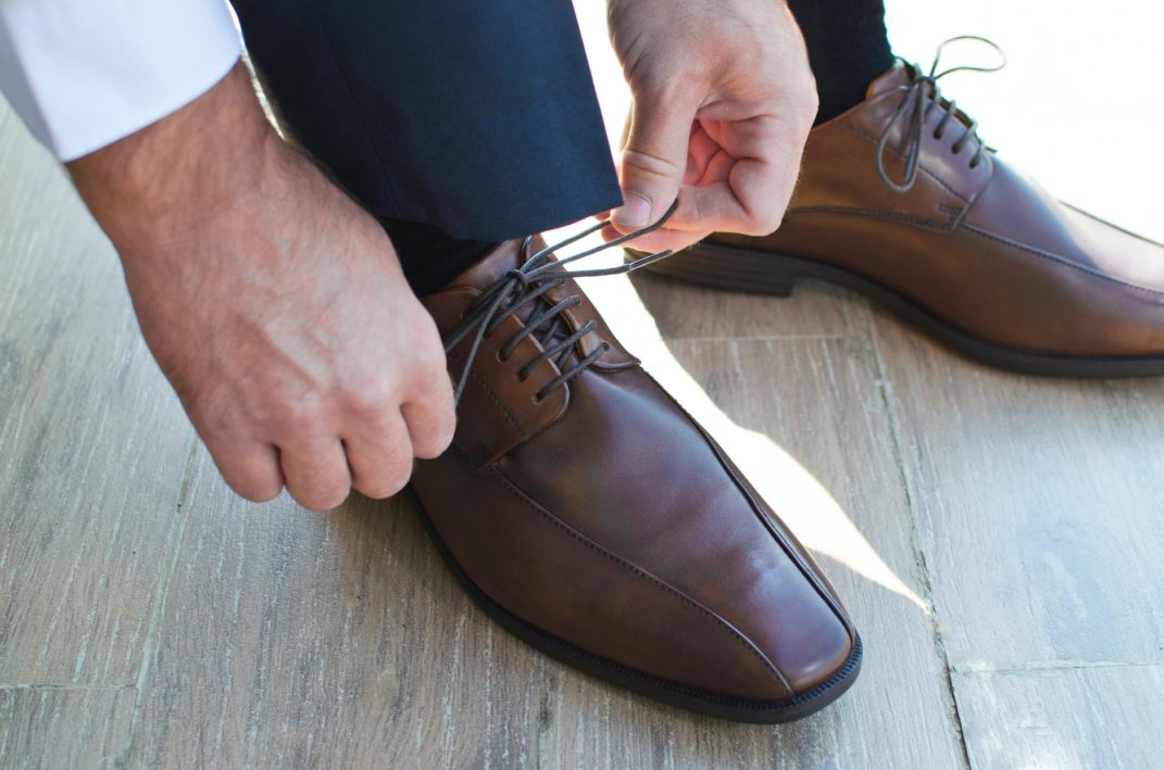 Person putting on shoes