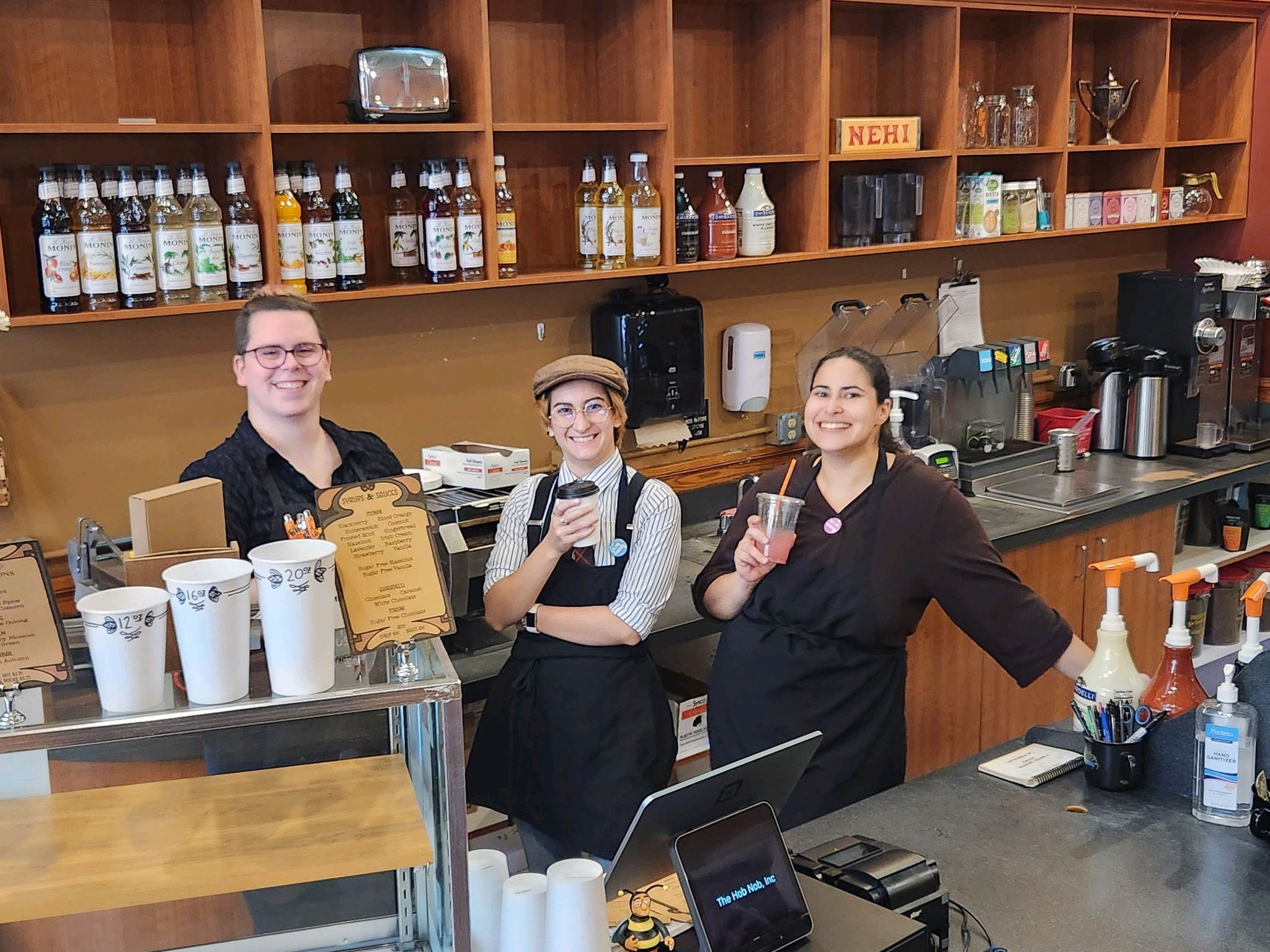 Employees posing at the counter