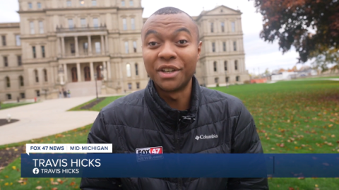 Reporter in front of capitol