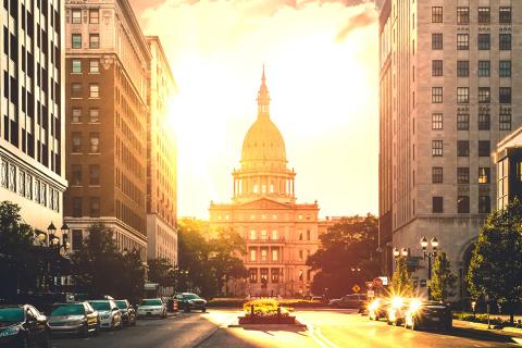 State of Michigan Capitol Building with a sunset in the background