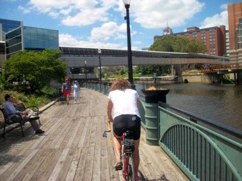 person on bike along the Lansing River Trail