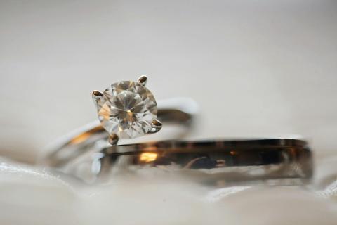 Two gold rings sitting on table