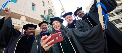 Graduates smiling together